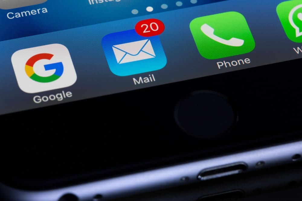 Close-up of email icon on smartphone.