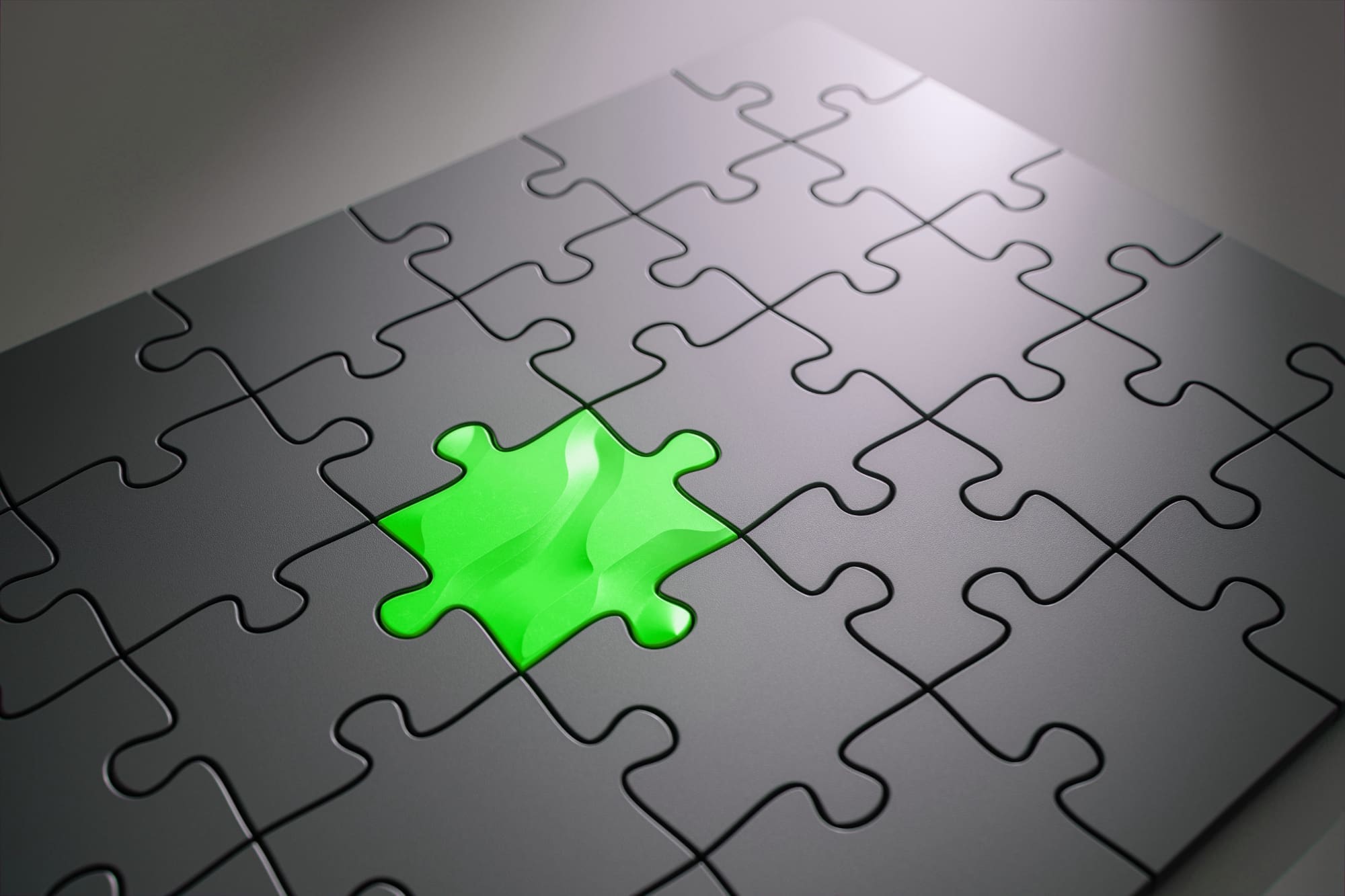 Integrate sustainability services All-grey jigsaw puzzle with one green piece slotted into the middle.