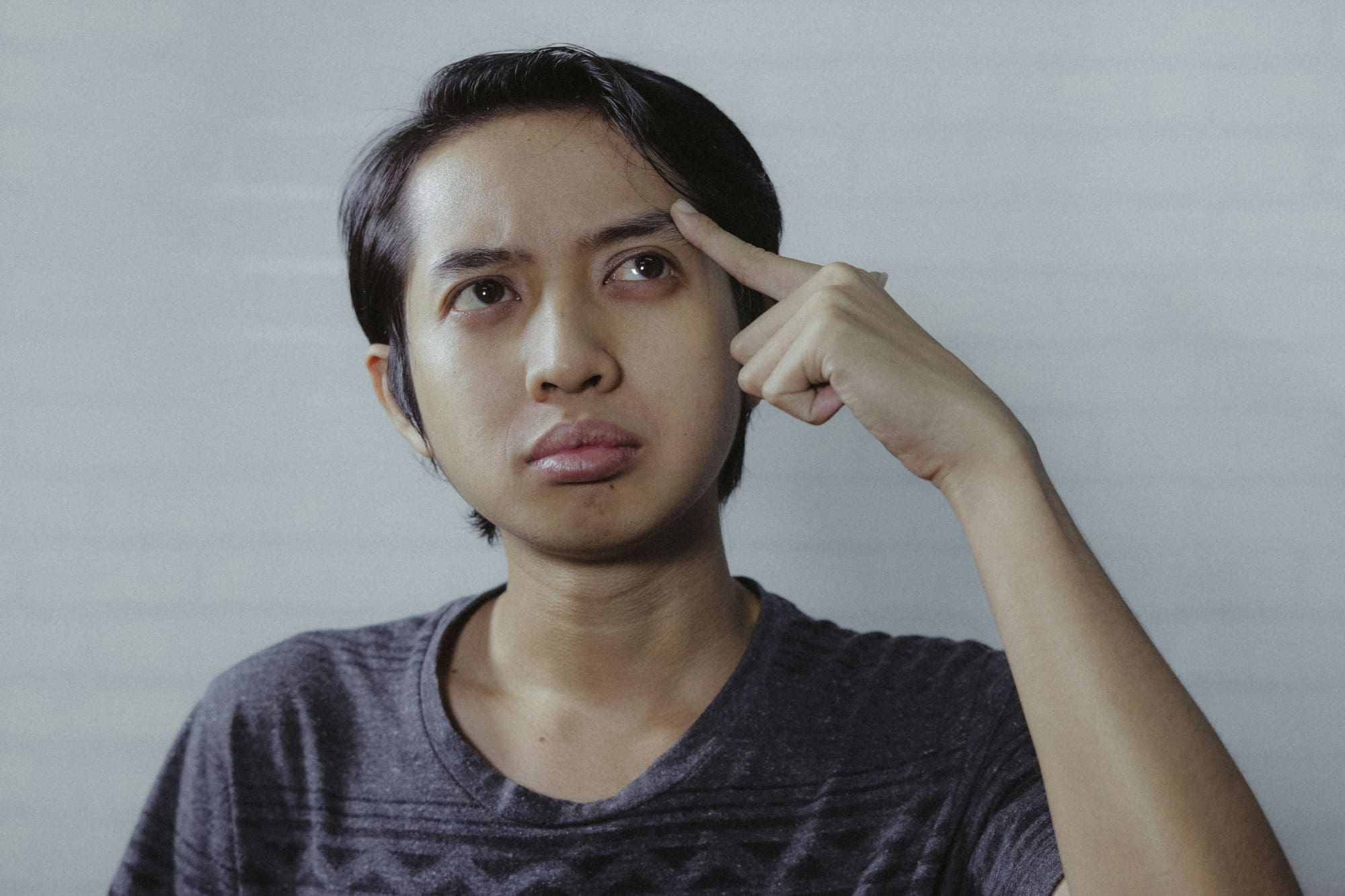 Still not sure Close up of office worker making confused face.