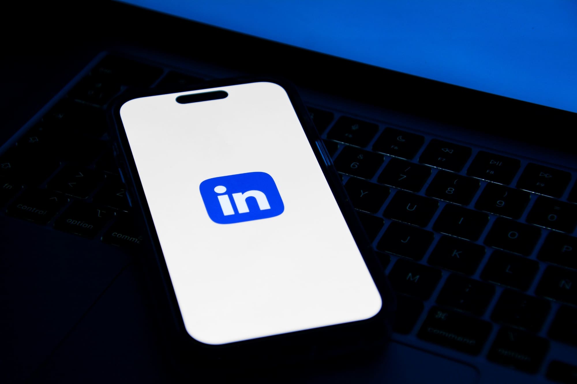 Smartphone with LinkedIn logo on the screen.